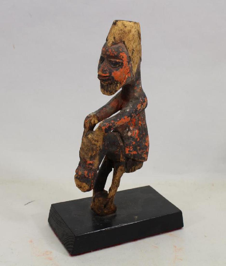 Yoruba Peoples Antique Equestrian Rider: Equestrian rider Yoruba peoples Nigeria early 20th c Wood with oil base paints 8"H x 4" W (EXCLUDING BASE) In good to poor condition, though still an attractive and sculptural fragment; old losses and