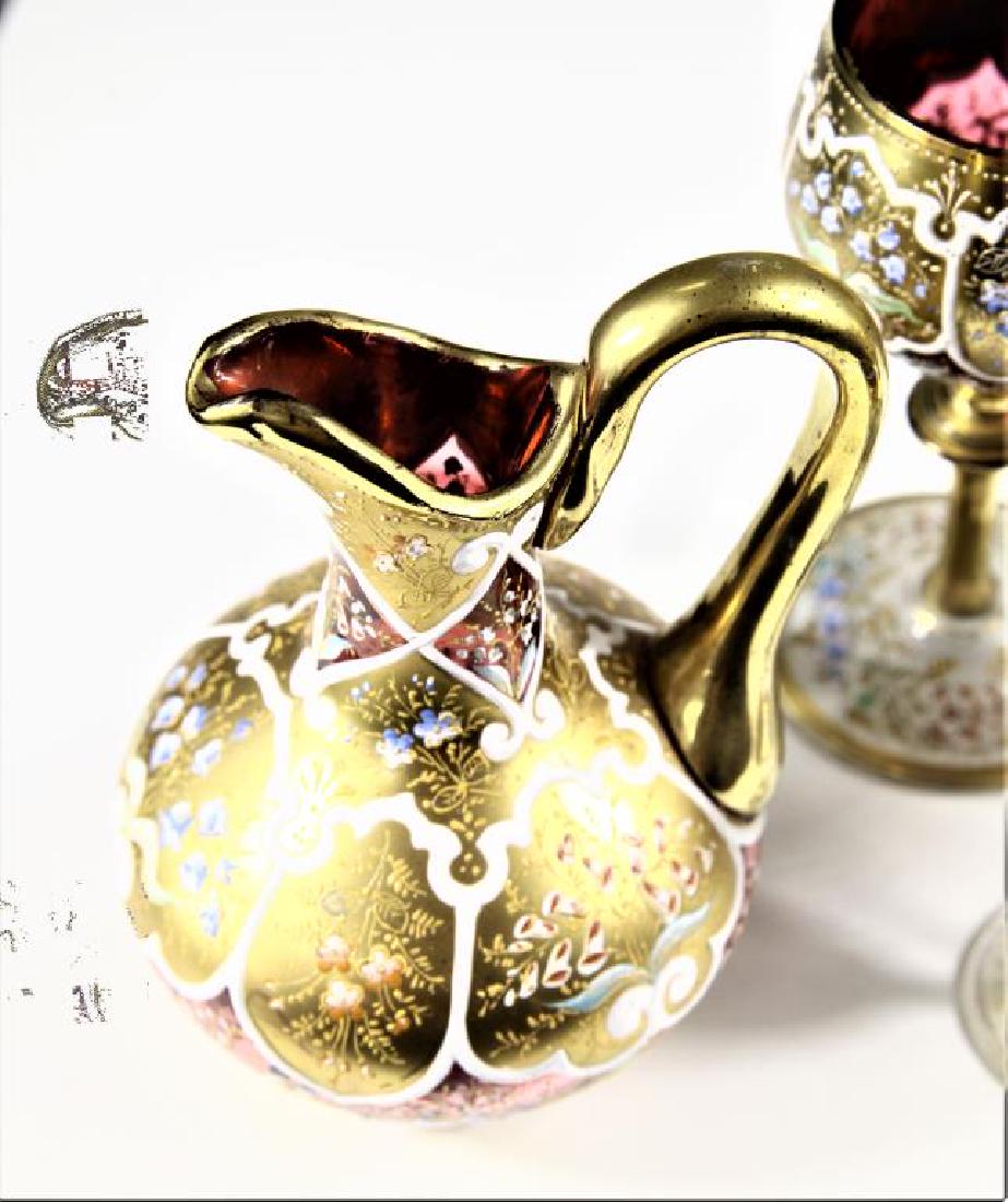 Four (4) pieces of Persian crystal, Moser-type: Four pieces of crystal: Two (2) wine goblets, one (1) ewer, and one (1) cordial, all with gold gilding and Persian enameled decorations, Moser-type,ewer is missing stopper, goblets are 5 1/8” h 