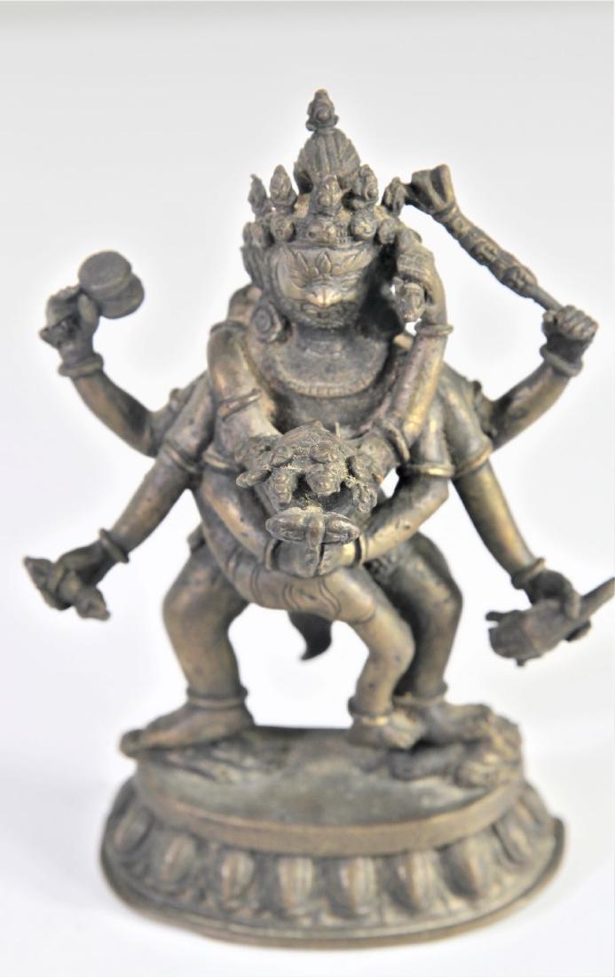 Tibetan Bronze Mahakala and his Consort Yab-Yum: Yab Yum a common symbol in the Buddhist art of India, Bhutan, Nepal, and Tibet. It represents the primordial union of wisdom and compassion, depicted as a male deity in union with his female consort. 