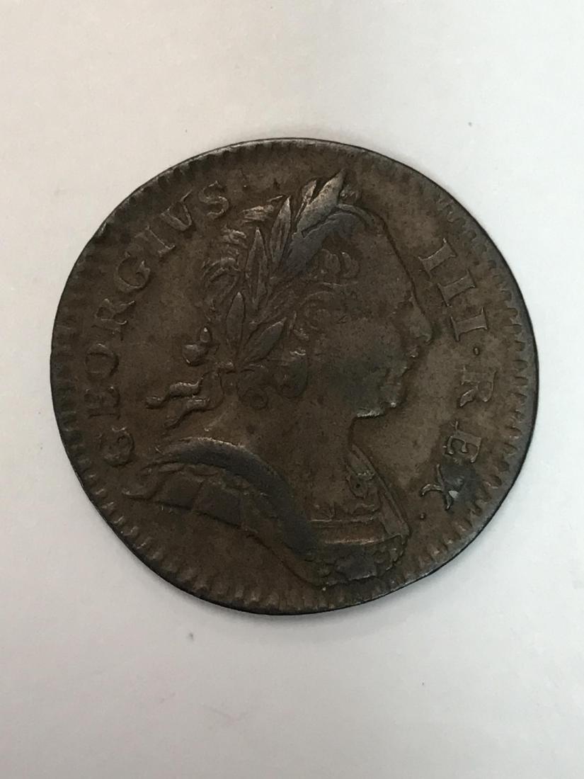 English coin from 1773, King George III: English coin from 1773, Georgius III on obverse, Britannia with shield, spear, and olive branch on reverse, 24 mm