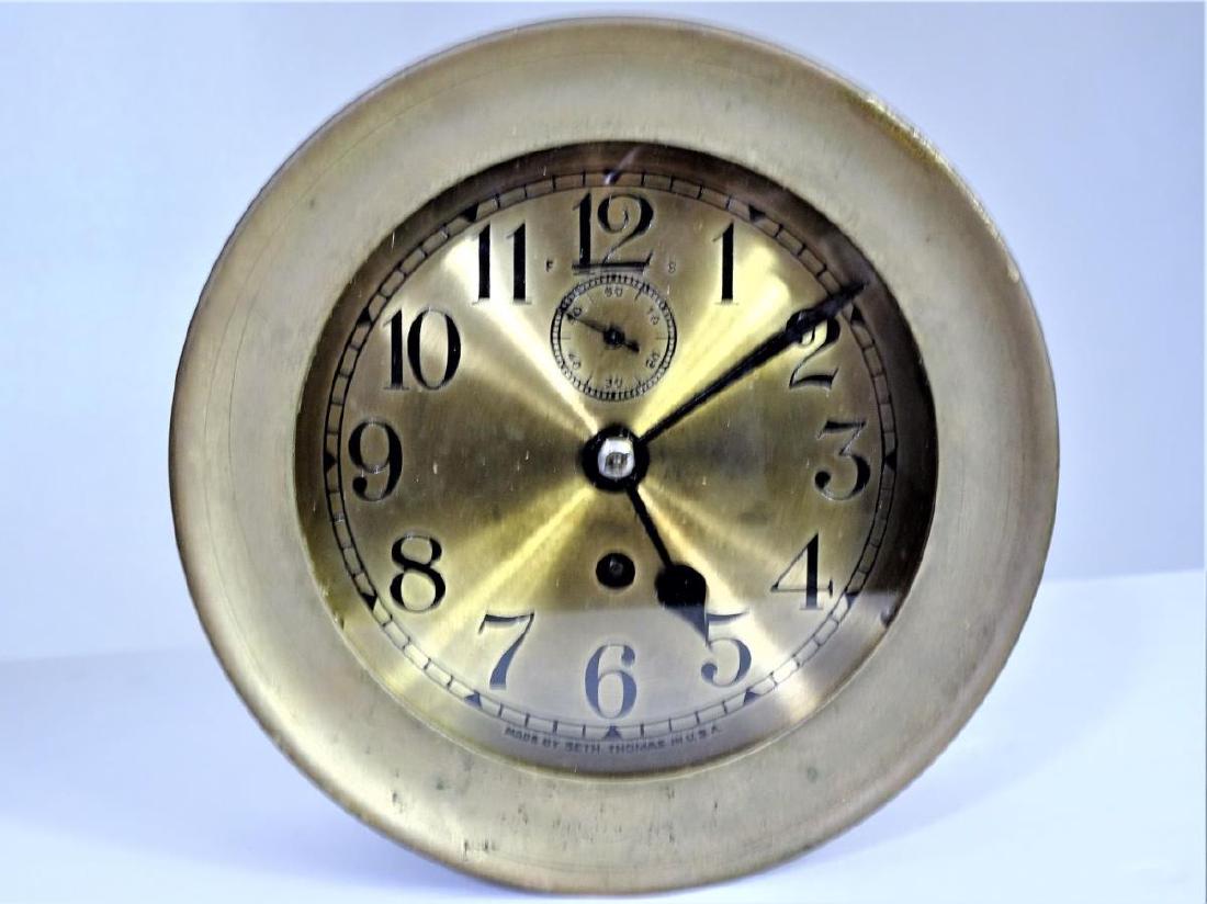 Seth Thomas Brass Ship’s Clock: This is an attractive Seth Thomas brass ship’s clock, probably made between the 1920’s and 1950’s. Near the bottom of the dial it reads “Made by Seth Thomas in U.S.A.” The clock has a glass