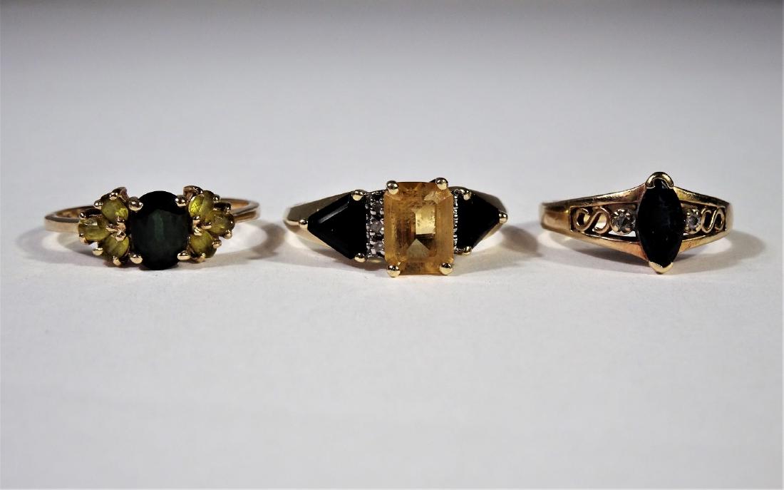 (3) Gold Rings with Sapphire and Yellow Gems: 14k, 10k, and 10k. 150