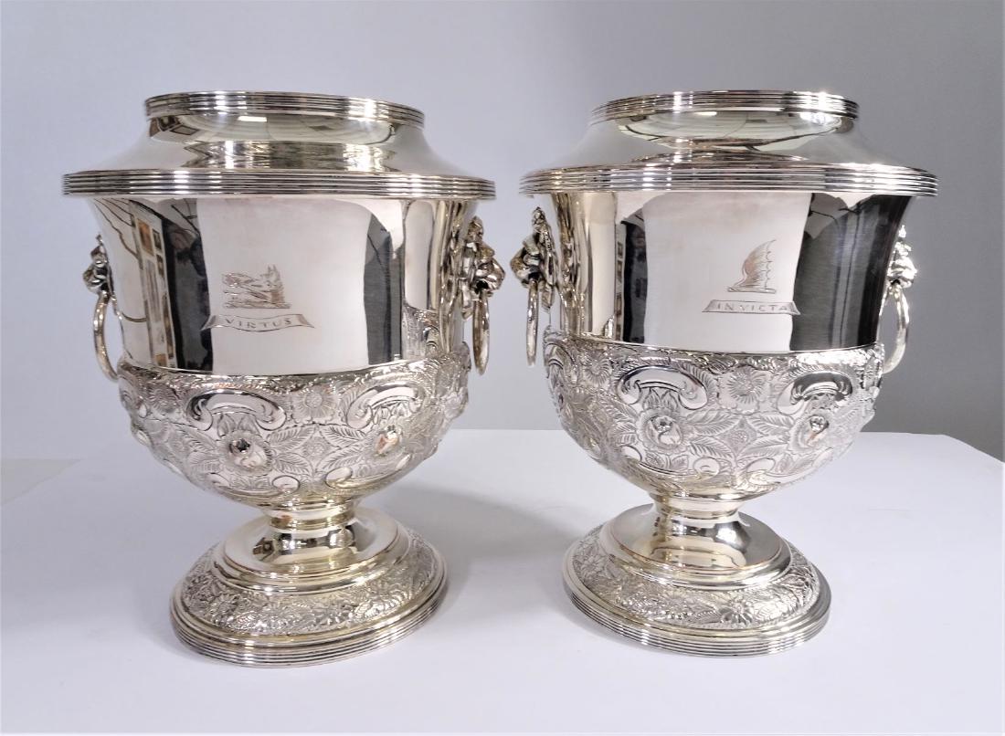 Pair of English Antique Silver Plated Wine Coolers: Pair are in excellent condition overall. There is a small amount of loss to plating on some of the outer edges to the outer rim and some small scratches are visible. Diameter is 8 inches at the widest
