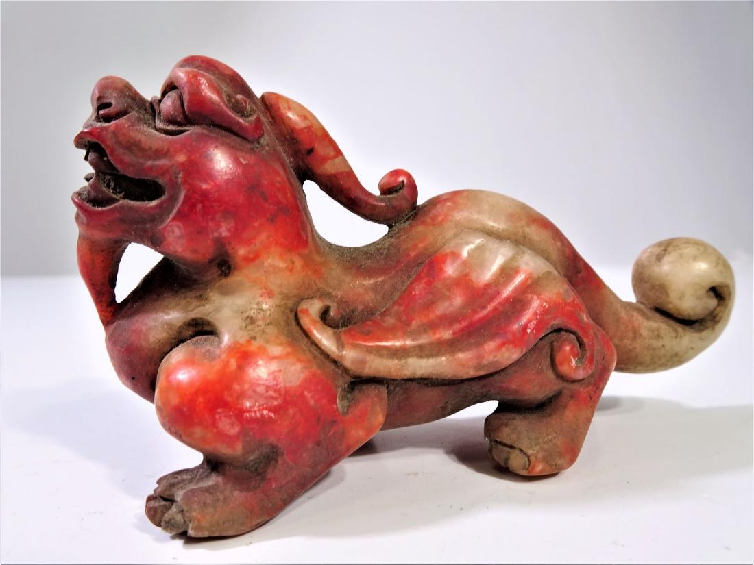 Carved Red Stone Figure of a Pixiu: 2 x 4 in. This is a particular species of chimera (an animal composed of parts from different animals) known as apixiu 貔貅 (pee-show); it has the head of a dragon, body of a lion, and a p