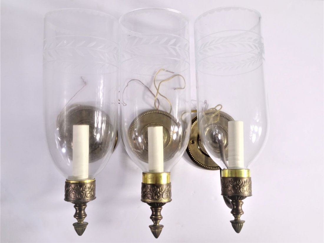 Three Electric Gilt and Glass Sconces: Size of each: under 14 inches long, 4 1/2 inches wide, 7 inches tall. Provenance: This item originally comes from the collection of a Newport, RI. mansion ex-Firestone Estate. CONDITION - By registeri