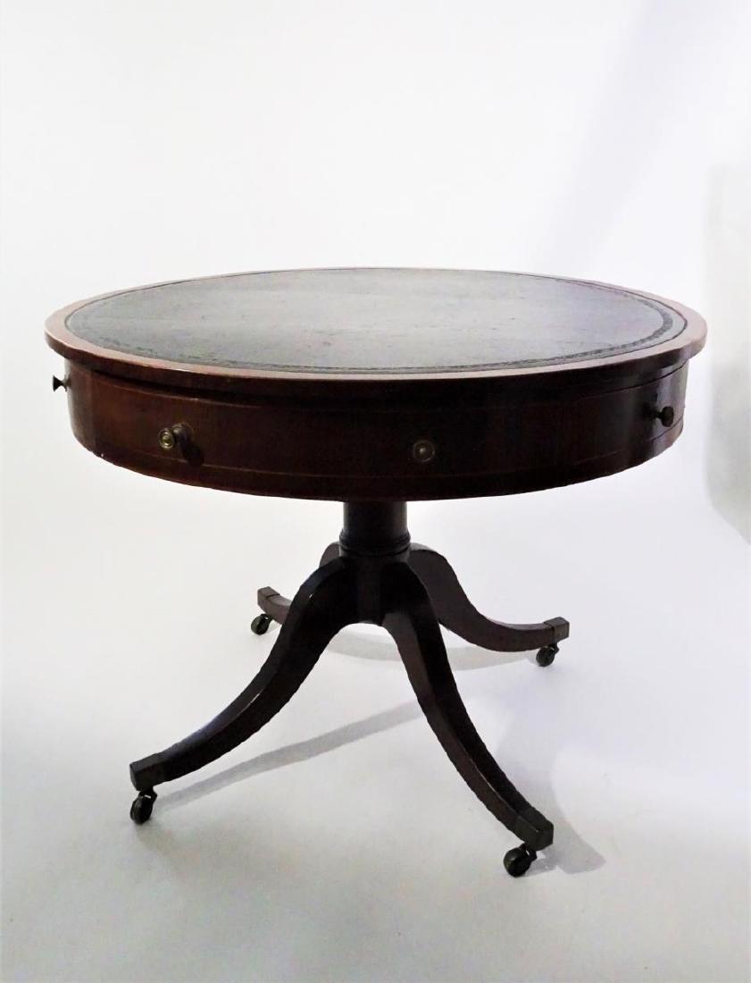 Antique Round Drum or Rent Table: Antique Round Drum or Rent Table with interval drawers in the apron and an insert leather top. Table is supoorted by pedestal base with outswept legs and caster terminus. Approx. c 1800. Good with wea