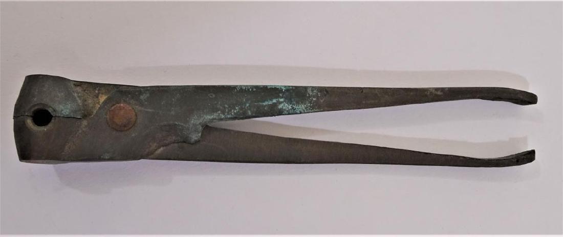 Early Bullet Mold: This bullet mold is an historic piece. It's 5 inches long, has a cavity hole about 1/8 of an inch wide, the cavity mold is round and is still in working order. The mold may have have been used for buc