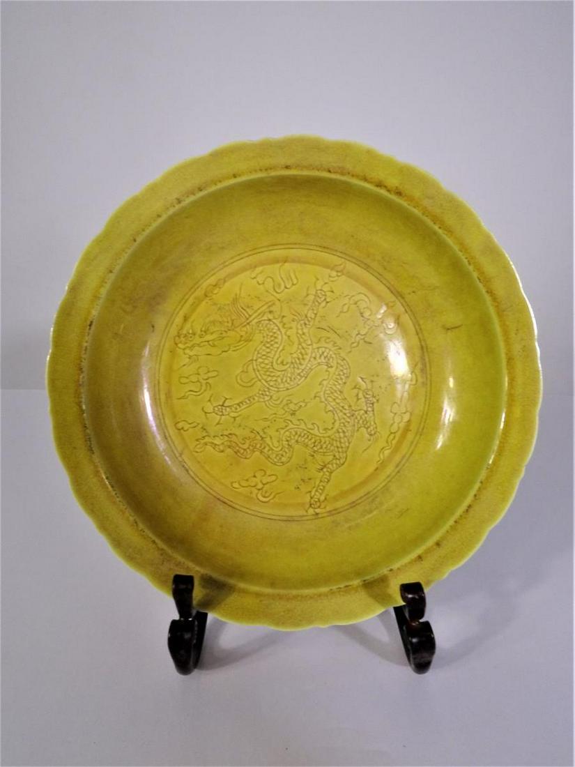 Chinese Mustard Dragon Bowl: Size: 2 3/4 x 8 3/4 in.MARK: Ming Dynasty 大明Hongzhi Reign (1488-1505) 弘旨年made製. Such “homage” marks are frequently used inreplicating styles of earlier pe