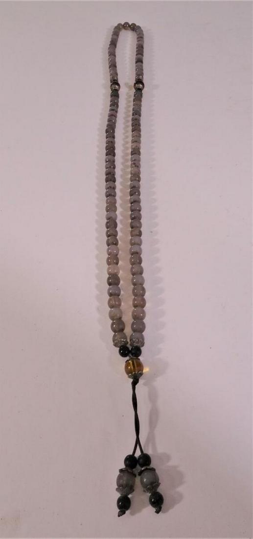 Long Beaded Mauve Necklace: 21 in. Please contact Eamon at Premier Shipping and Crating for a quote to pack and ship at 941-358-9999 or email at info@premiershipment.com