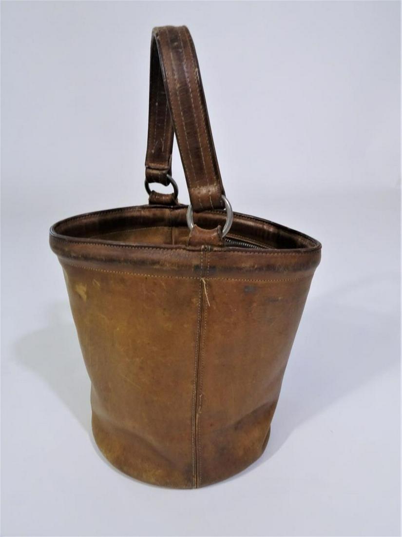 RARE 1968 Coach Camel Bucket Bag with Legacy Strip: Designed by Bonnie Cashin (1961-2000) Signs of wear. Ink stains. Size: 14 in. H (including handle), 8 1/4 in. H (only bag), 7 1/2 in. diameter (bottom) Please contact Eamon at Premier Shipping and Cra