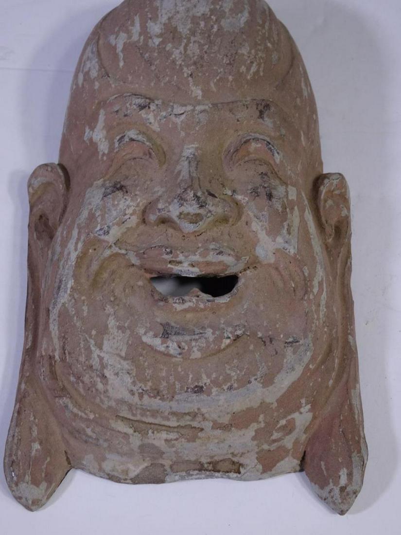 Antique Chinese Wooden Laughing Buddha Face: Size: 7 in. L x 4 1/2 in. W x 2 in. Depth Please contact Eamon at Premier Shipping and Crating for a quote to pack and ship at 941-358-9999 or email at info@premiershipment.com