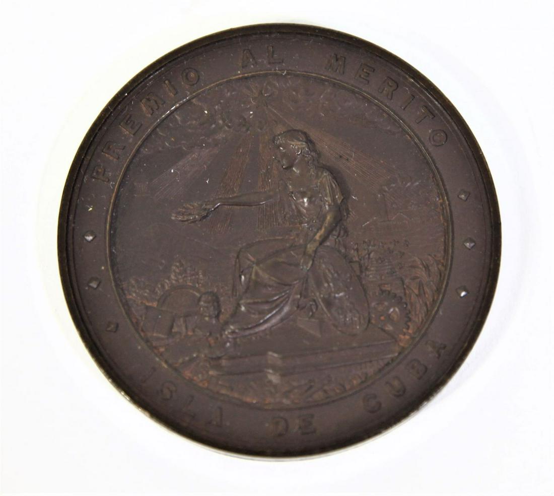 Bronze Medal Merit Award from Cuba 1881: Third place medal from Exposicion De Mantanzas held in Cuba in 1881 to promote socialism and nationalism in Cuba, marked P Vidal below sitting figure on face. 2 5/16 " in diameter. Please contact Eamo