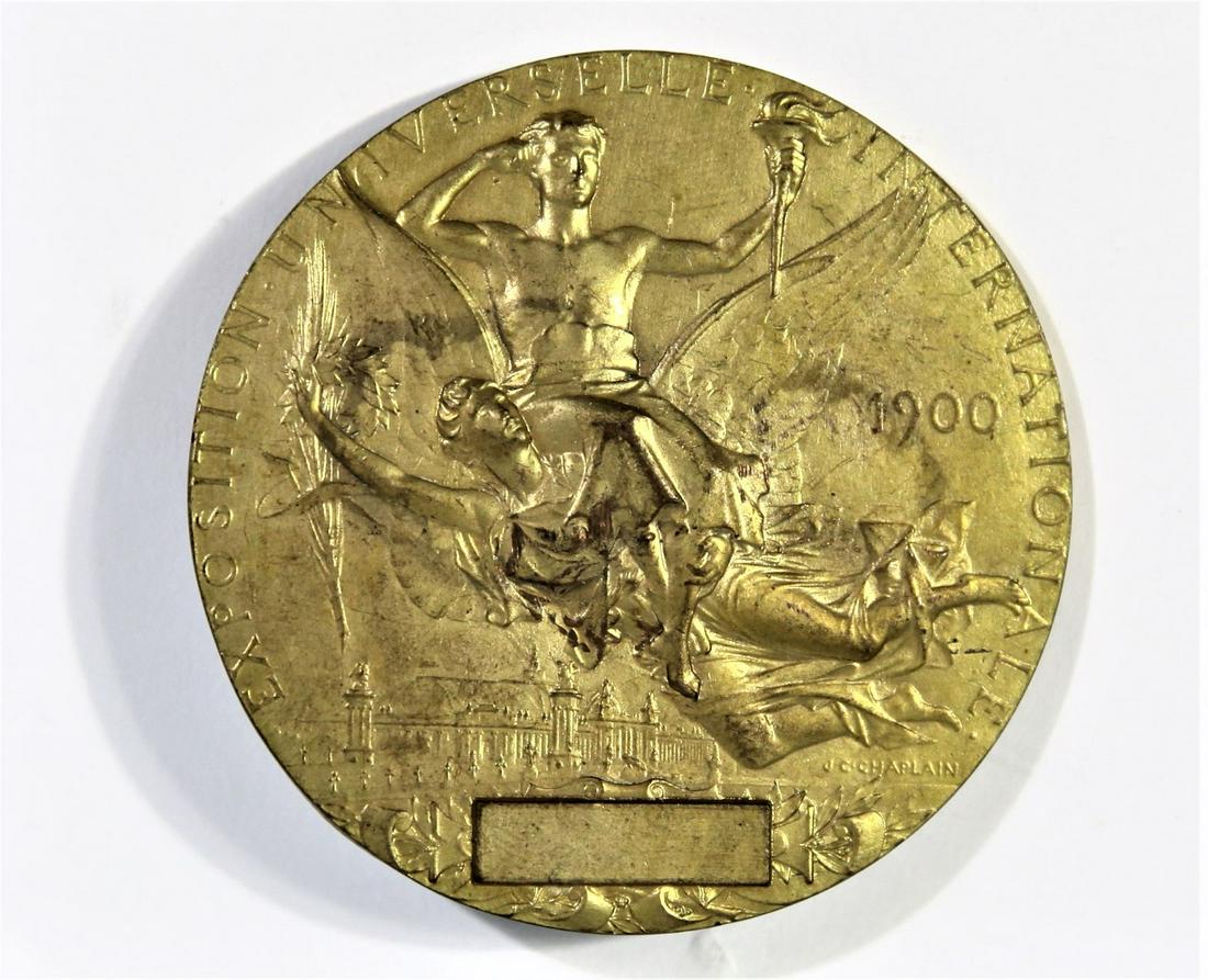 1900 Paris Exposition First Prize Medal: This is a gilded bronze first prize pin or medal from the Paris Exposition in 1900. It reads "Exposition Universelle Internationale" and "J C Chaplain" on the face. Chaplain was the designer of the pi