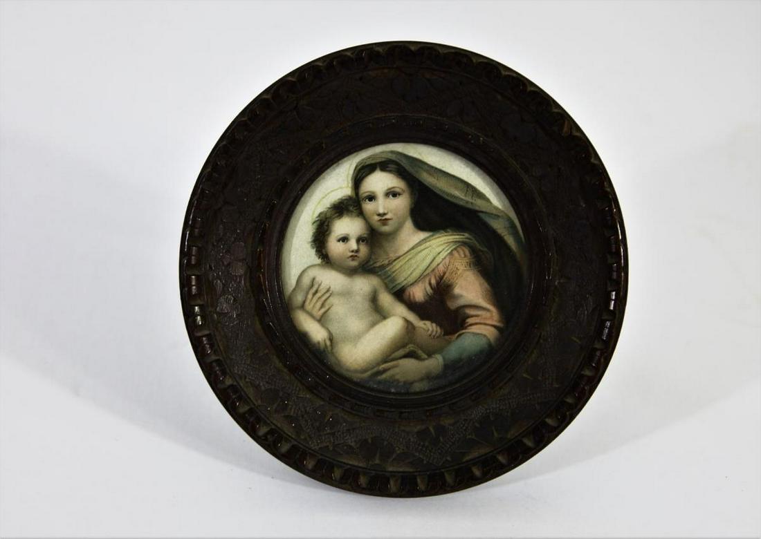 19th C. Mother and Child Portrait: This attractive portrait stand features a mother and child on the front, decorated wood carving, and a reverse-Y post on the back to prop the piece up. The image on the front is covered with glass, an