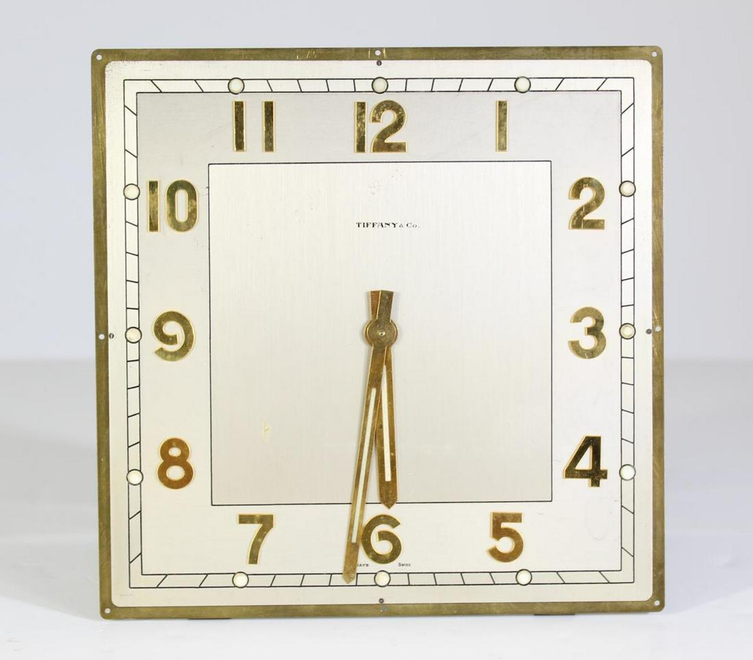 Tiffany and Co. Gold-Plated Clock: This is a Tiffany 8 day Swiss clock, with Tiffany & Co. on the clock face and serial number 12108 marked on the back. The edges appear to be patinated brass and the numbers are gold-plated. The dimens