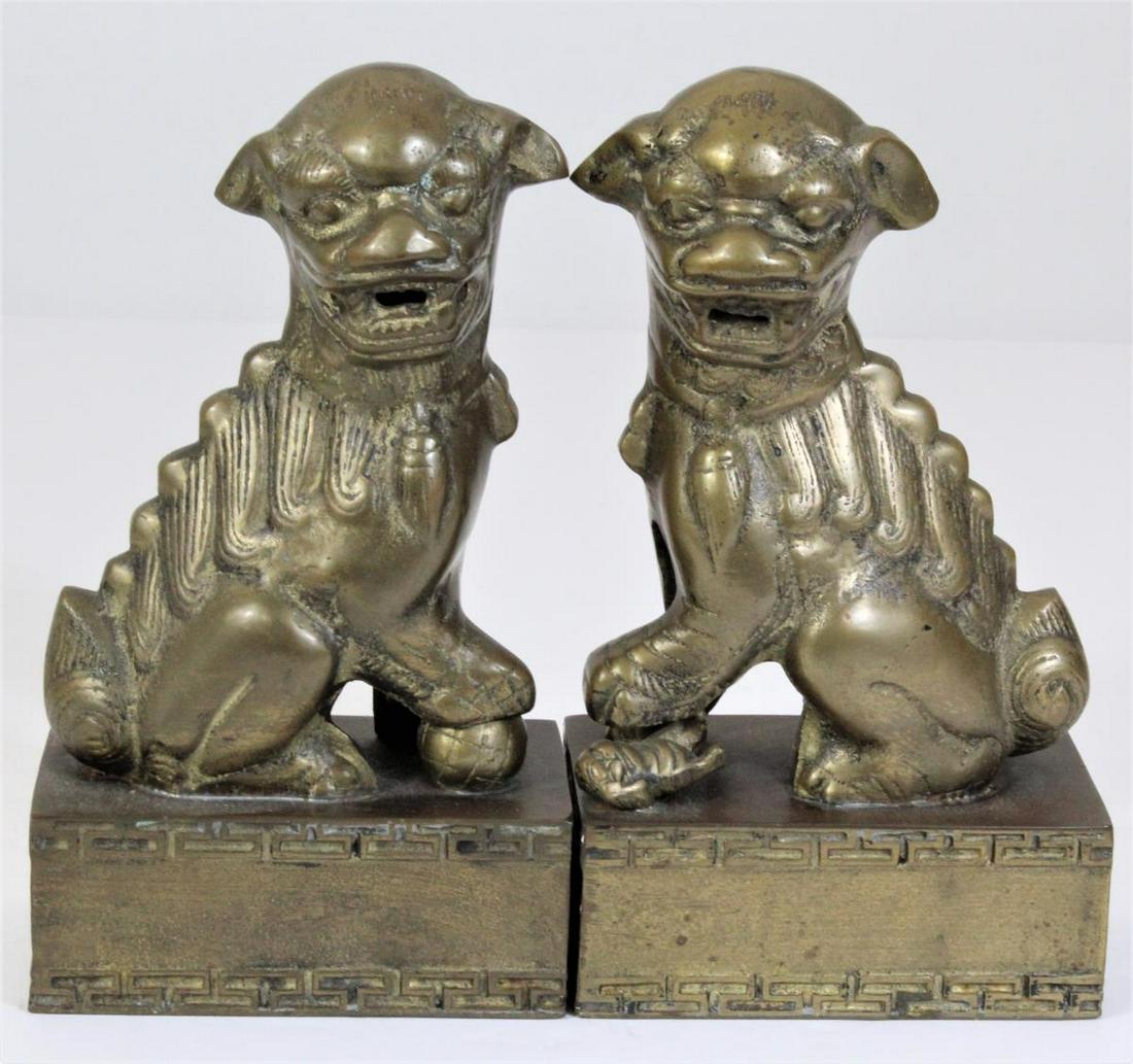 Pair of Bronze Foo Dogs: Size: 8 1/2 in. H x 4 3/4 in. W x 2 3/4 in. L