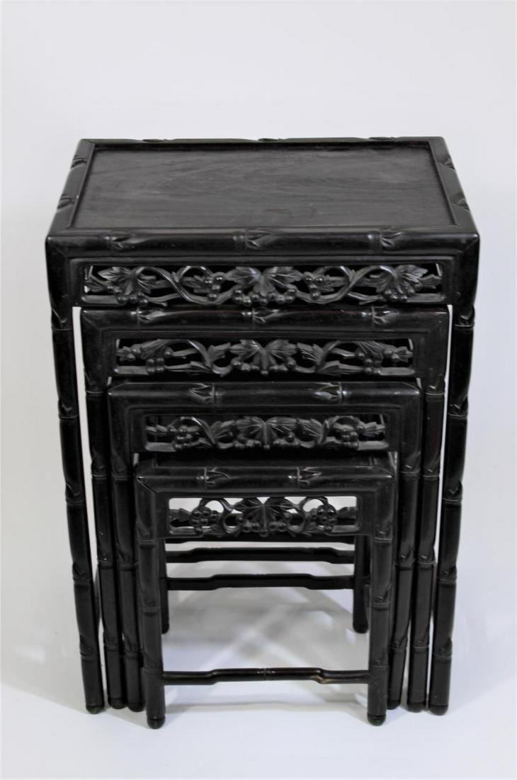 19th C. Set of 4 Chinese Carved Nesting Tables: Sizes: (largest to smallest) 1) 27 1/2 in. H x 19 3/4 in. W x 14 1/2 in. D 2) 23 3/4 in. H x 17 1/4 in. W x 12 1/4 in. D 3) 19 3/4 in. H x 15 in. W x 10 1/2 in. D 4) 15 1/2 in. H x 12 3/4 in. W x 8 3/