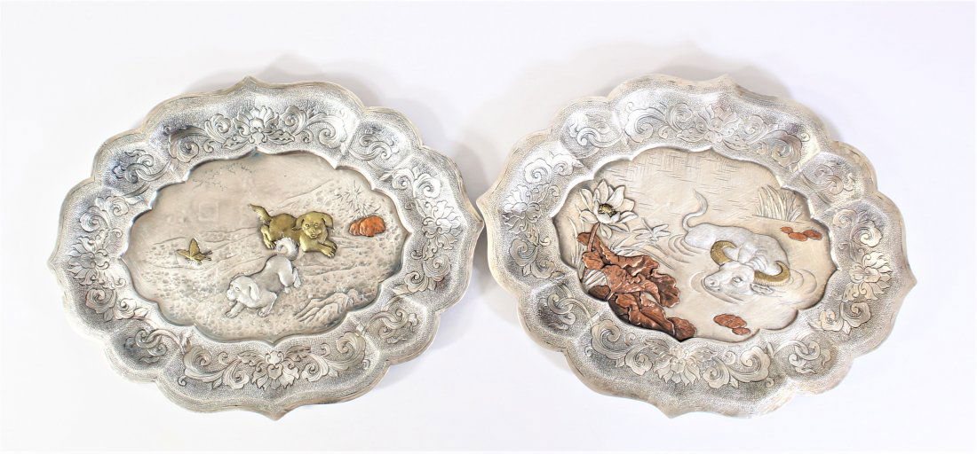 Pair of Silver, Etched Chinese Plates 28 OZT: Measurement: 10 1/2 x 8 in. Finely etched and adorned with multi-metal animal designs.27.895 OZT