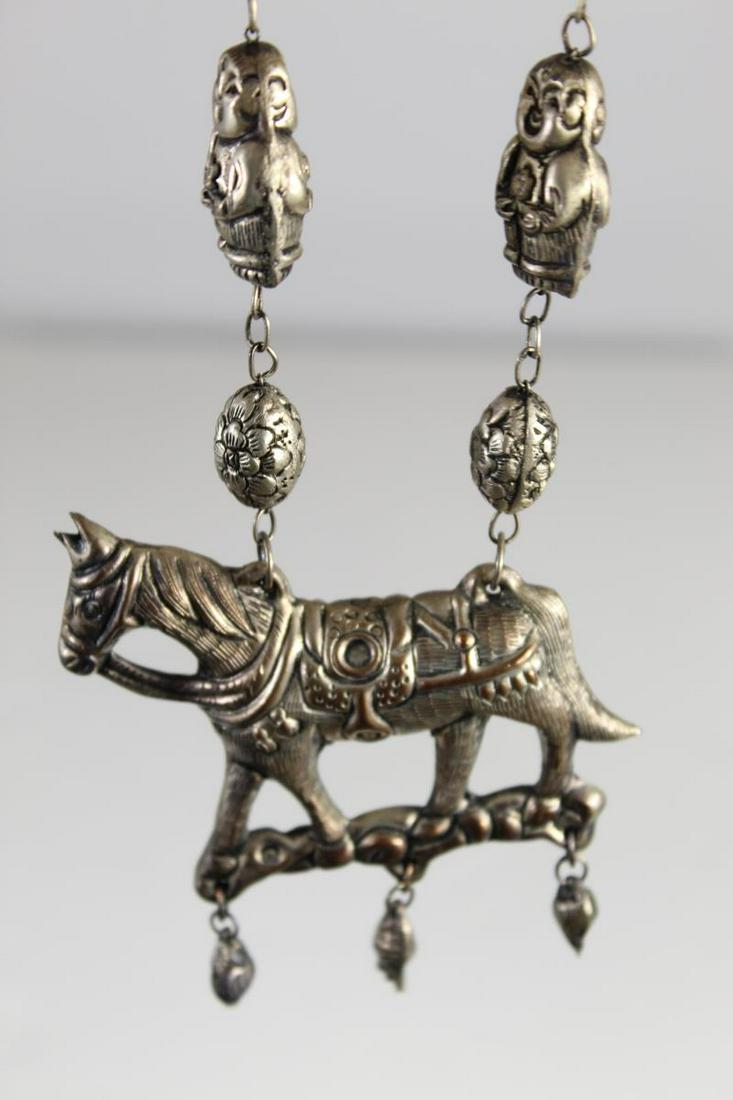 Chinese/Tibetan Silver Horse & Buddha Necklace: Length: 13.5 in. Appears to either be Chinese or Tibetan necklace. Great figural design with a horse pendant, and buddhas on the line of the necklace.