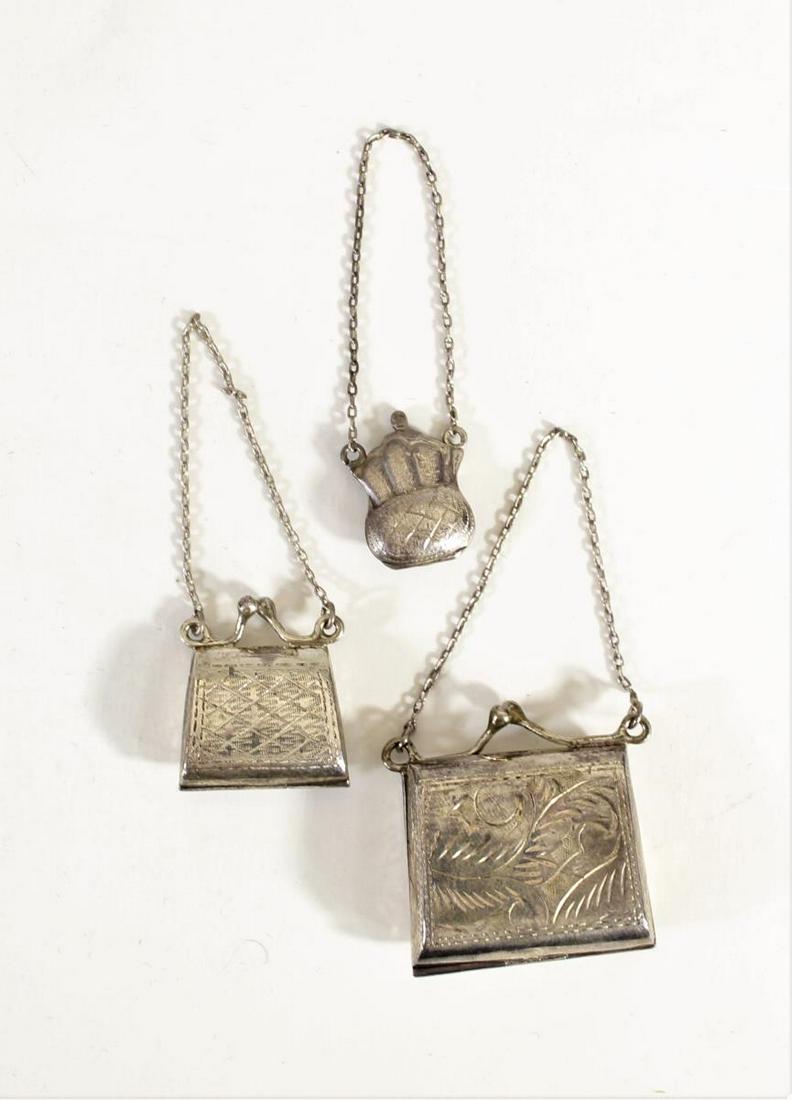 Set of (3) Sterling Silver Jewelry Purse Lockets: All around 1 in. ozt: .545 Sterling silver jewelry purses with etched designs. All marked 925 on the inside of the lockets.