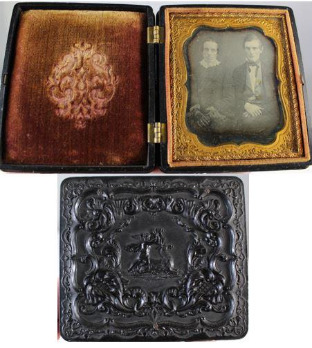 U.S. Thermoplastic Case w/ Cupid and Stag 1850's: This is a thermoplastic union case with a daguerreotype of a couple, probably husband and wife. The ambrotype is a sixth plate, and the embossed covers depict Cupid with a wounded stag; the motif is r