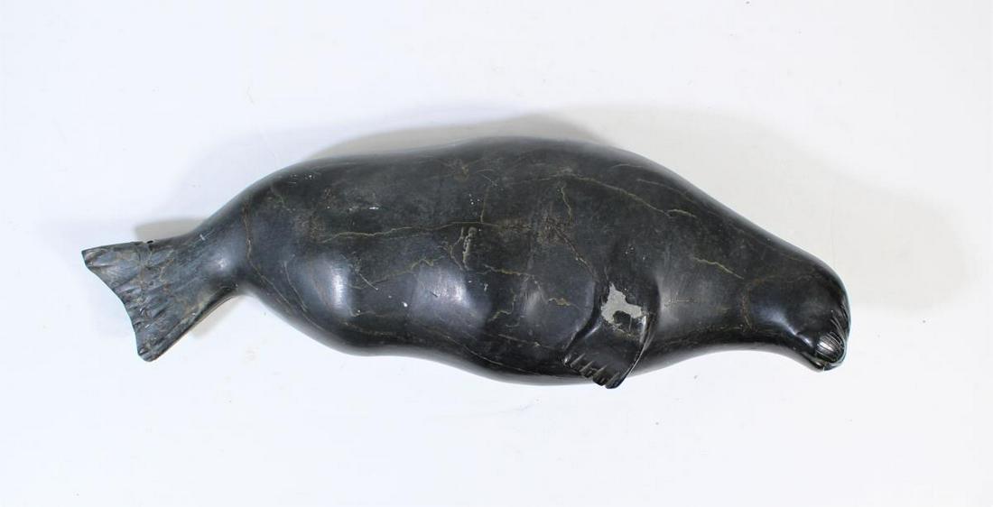 Soapstone Seal Carving - Inuit: This soapstone carving of a seal is etch-signed on the bottom. As is, 5 x 14 1/2 x 3 in. deep.