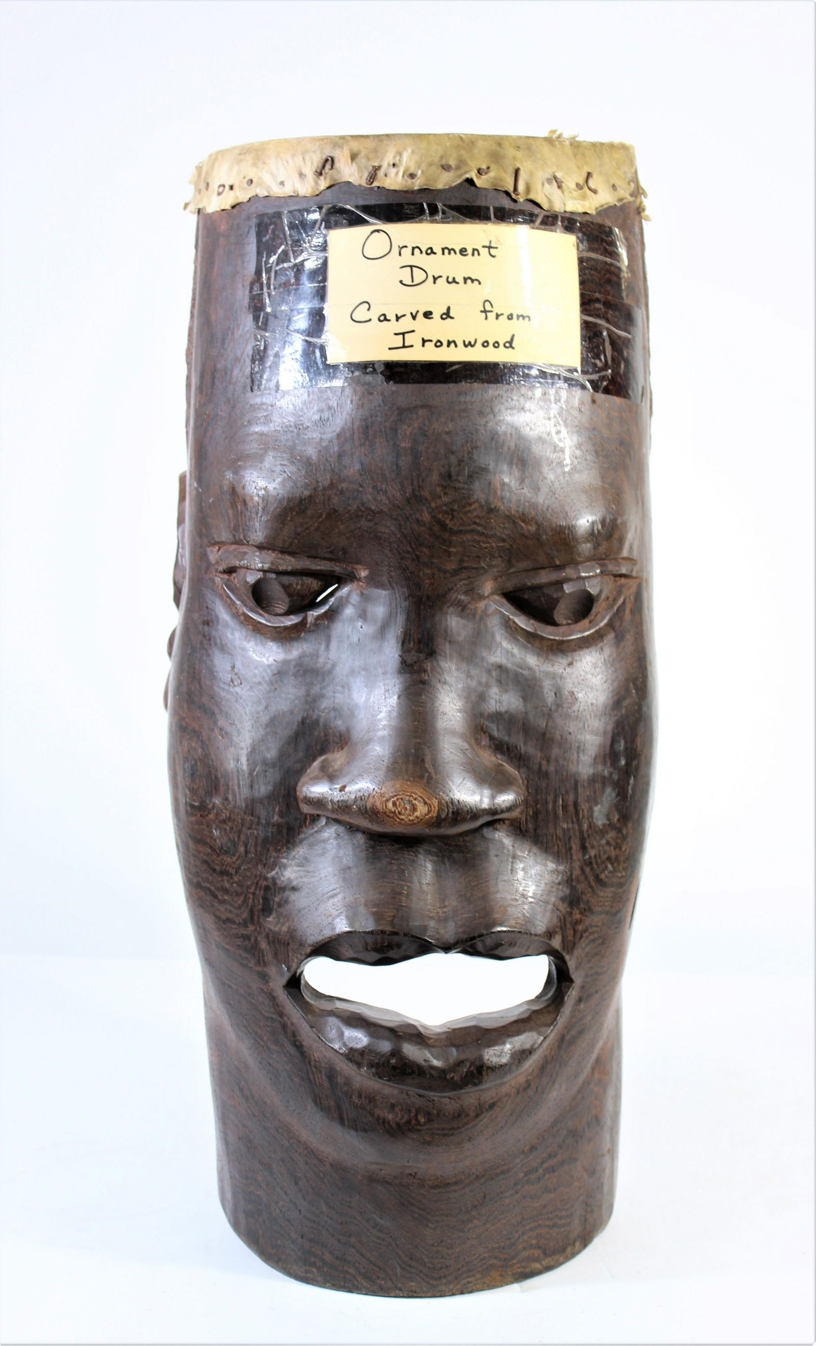 African Ironwood Ornament Drum Early 1900's: A tall drum from the Central African Republic. The drum was used for ceremonies and ornamentation. It was hollowed out from one piece of ironwood and covered with animal skin on top for beating and cr