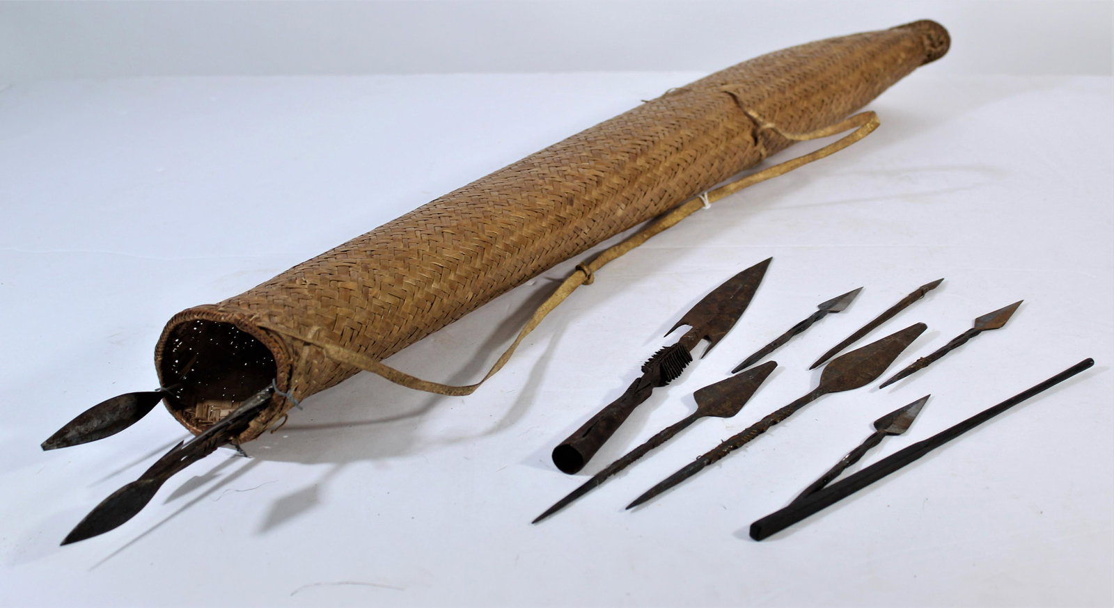 African Quiver and Arrows from 1900: This sheath or quiver and arrows came from the Central African Republic. The arrows were probably used for fishing or hunting small game animals, and when a villager went hunting, he would wear the qu