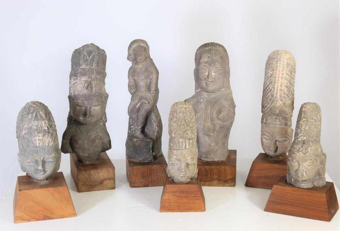 Collection of Indonesian Carved Stone Heads: Pieces were acquired in Indonesia in the early 60s. All Pieces have wooden bases. Size: under 11 1/2 in. H