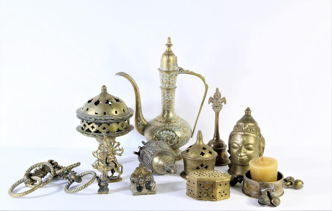 Collection of 12 Brass Indian Pieces: Pieces vary from teapot, containers, bell, and camel bit. Sizes vary: smallest is 1 1/2 x 1 in. largest is 6 1/2 x 8 3/4 in.