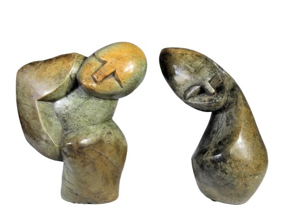 E Mukonbacho, signed Pair of Zimbabwe Stone Sculptures: Abstract Sculptures are signed "E Mukonbacho". Both pieces are under 10 in. in height and 6 to 7 in. long and approx 2 in. wide