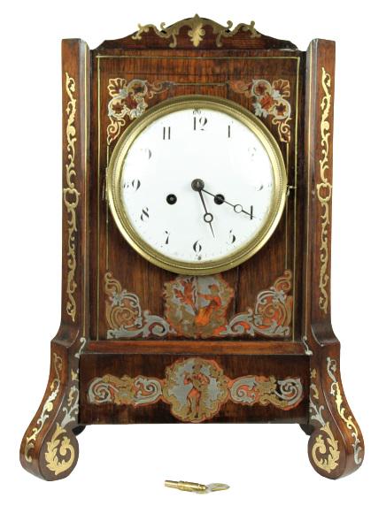 German Cabinette Toillete Clock: Circa 1790.Mahogany cabinet inlaid with silver, brass, and incized tortoise shell. Silk thread movement. Measurements: 8 1/4 x 5 / 13 1/2 in. Please note that all sales are final and no refunds will b