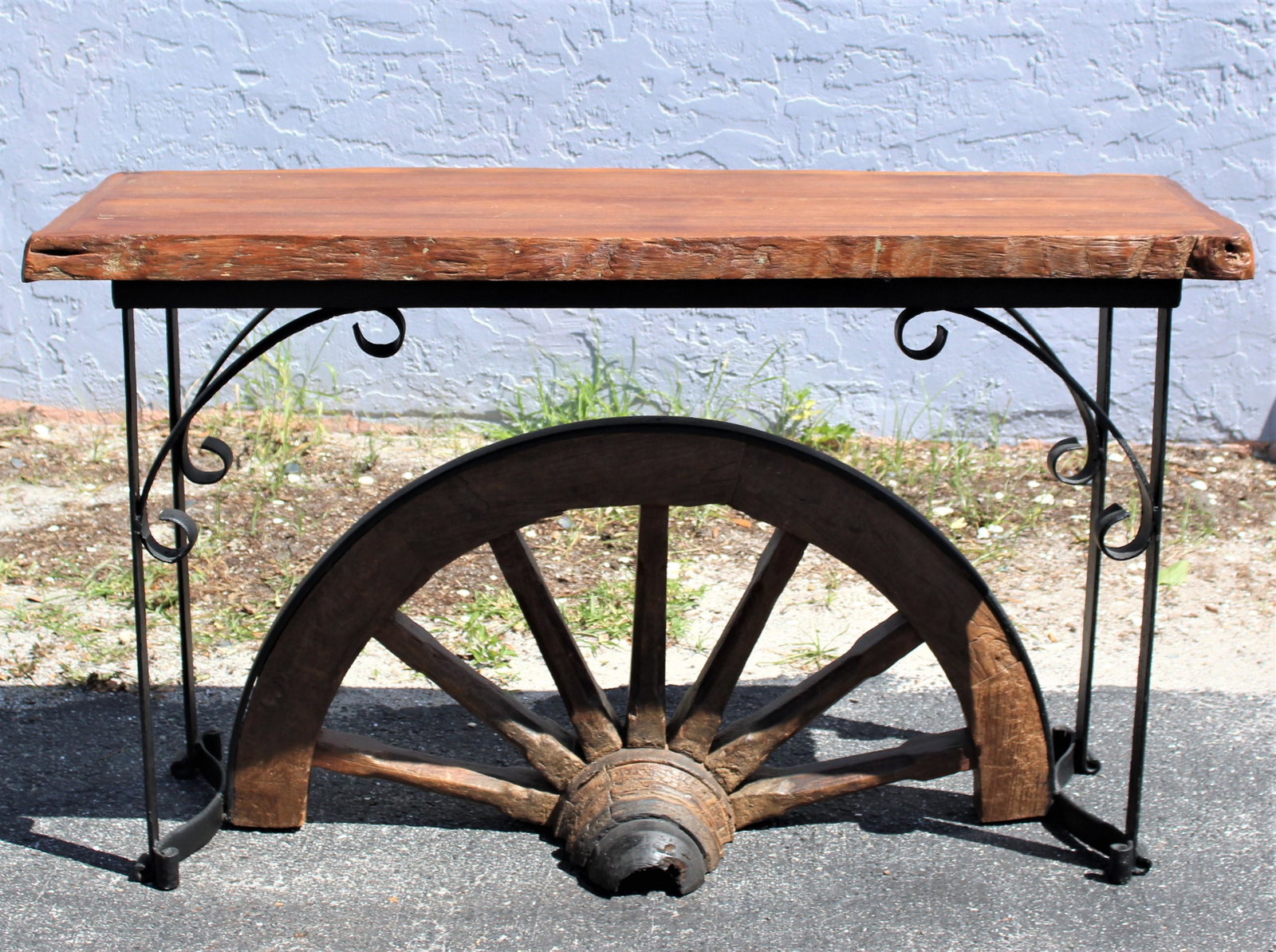 Wood and Iron Wagon Wheel Consol Table: One-of-a-kind wood and wagon wheel console table. Measurements: 55 x 18 x 32 in. Please note that all sales are final and no refunds will be given under any circumstances. Sarasota Estate Auction prov