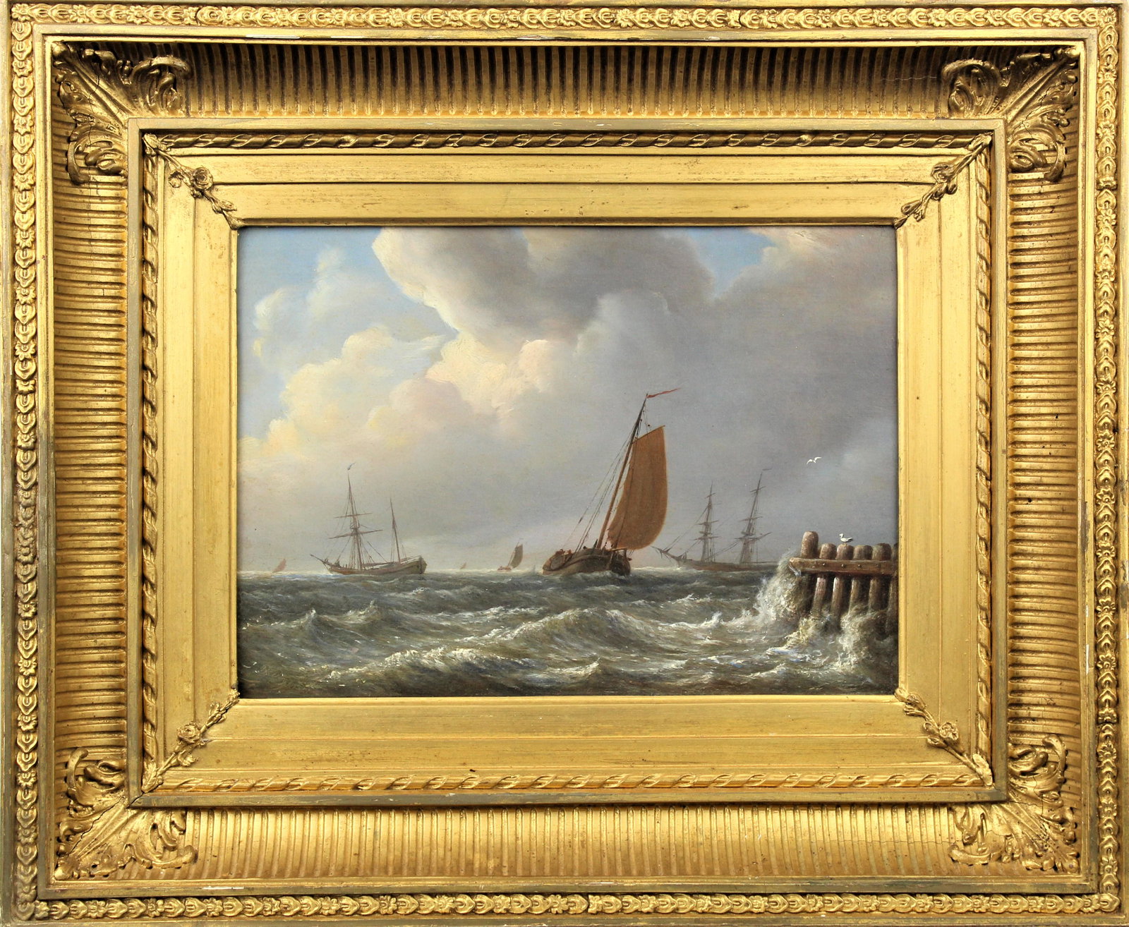 Mid 19th C, Coastal Marine Scene, Oil on Board: Coastal Marine Scene, Mid 19th C. Coved fluted gilt frame. Inscribed verso. The painting depicts a sail boat and several other distant ships amongst crashing waves. Overall size: 14 1/2 x 17 1/2 in.Si