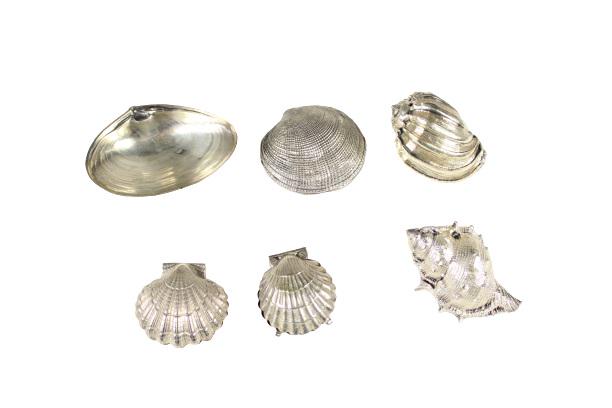 Collection (6) Silver & Silver Plated Shell Forms: Collection of six 20th century shell forms consisting of: three shells encased in silver; one Wallace sterling clam-formed footed shell, circa 1900; two scallop shell hinged boxes.Please note that all