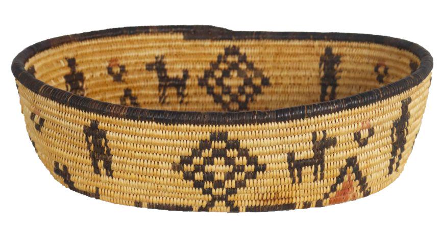 Oval Apache Basket: A finely woven three-color coiled basket of geometric design with repeating animal and man motif. Intact condition, but there is a stain on inside of basket. Circa 1920, artist unknown. Size: 9 1/4 x 