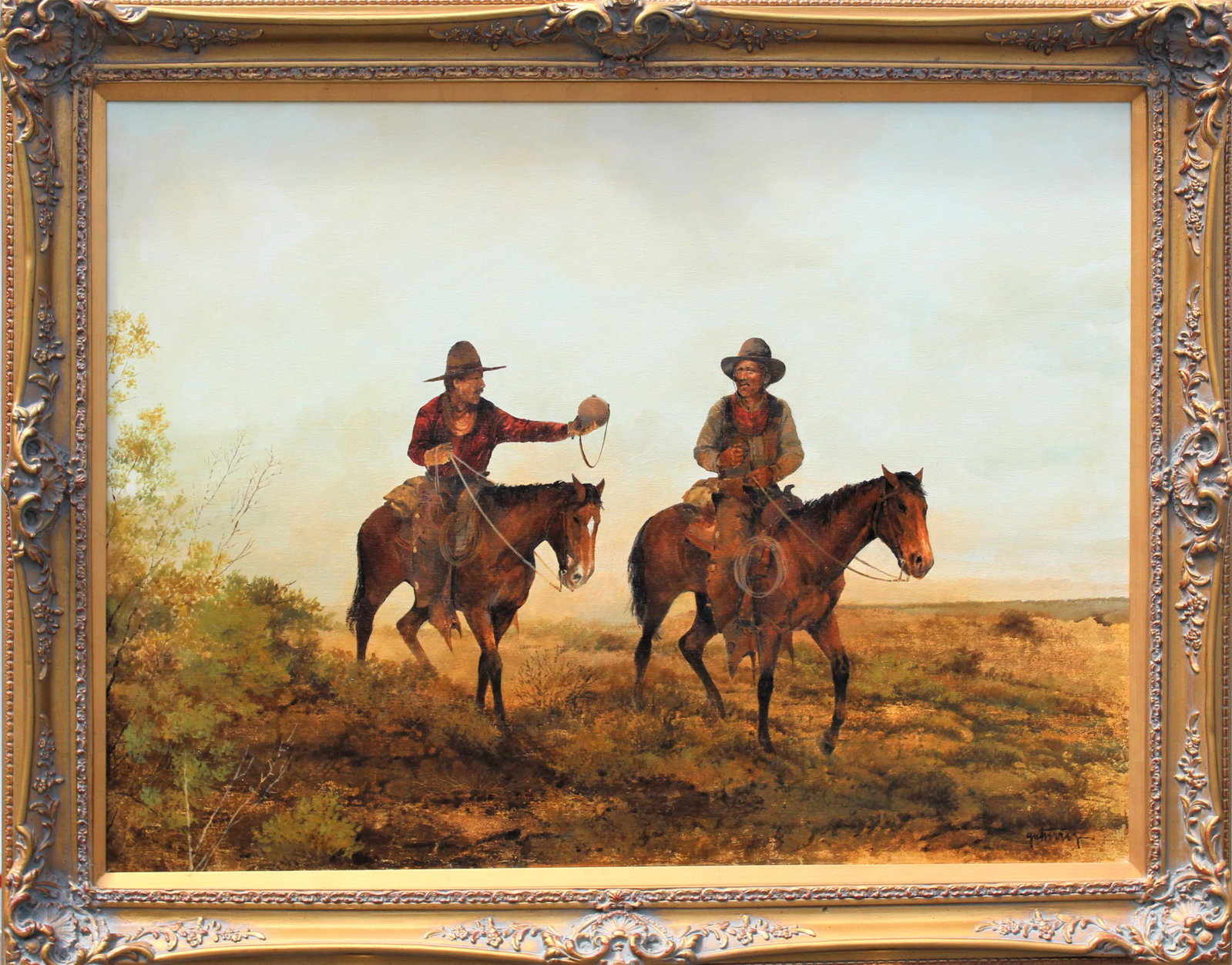 Raul Gutierrez (B 1935) Texas, Oil on Canvas: Large Western landscape painting by Raul Gutierrez signed Gutierrez in the lower right. Two men riding their horses out in the field. Born in Laredo, Gutierrez moved to San Antonio with his family dur