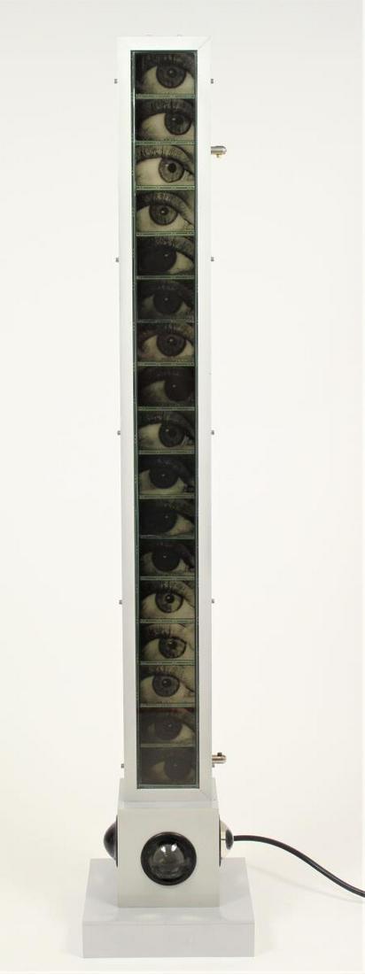 Eye Tower Sculpture: Truly unique electric lighted 'eye tower' sculpture, a series of seventeen eyes, housed within a plexiglass and metal foundation. All four sides of base have an eye bubble effect, marked TODT -NE 9/9.