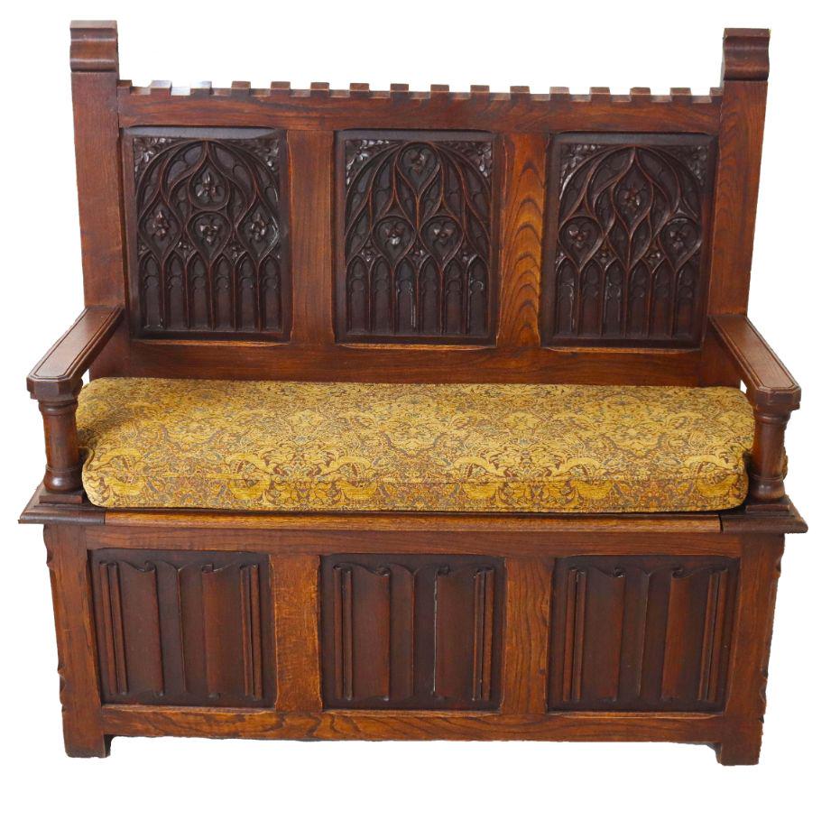 Renaissance Revival Hall Chair/Sette: Linen Fold Carved Oak revival chair with stoage under seat. Circa 1900. Measurements: 49 1/2 x 18 x 47 1/2 in. Please note that all sales are final. No refunds will be given under any circumstances.