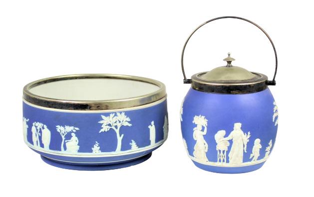 (2) Wedgwood Jasperware Containers: Two blue Wedgwood containers with metallic rims. One container also has a lid and handle. Measurements: Bowl - 4 1/4 x 8 3/4 in. Pot - 9 x 5 3/4 in. Please note that all sales are final. No refunds wi
