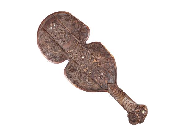 Early Maori War Club: Originally purchased in New Zealand in 1930 from a tribal member. Wooden hand-carved New Zealand Maori patu or war club, traditionally used as a one to one combat striking weapon. Inset with paua shel