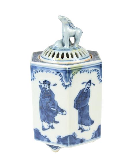 Chinese Porcelain Blue and White Incense Burner: This is a Chinese Porcelain blue and white incense burner. It has a horse final with Chinese figures depicted around the sides. The figures are of Ming Dynasty scholar/officials Size: 5 1/2 x 2 3/4 in