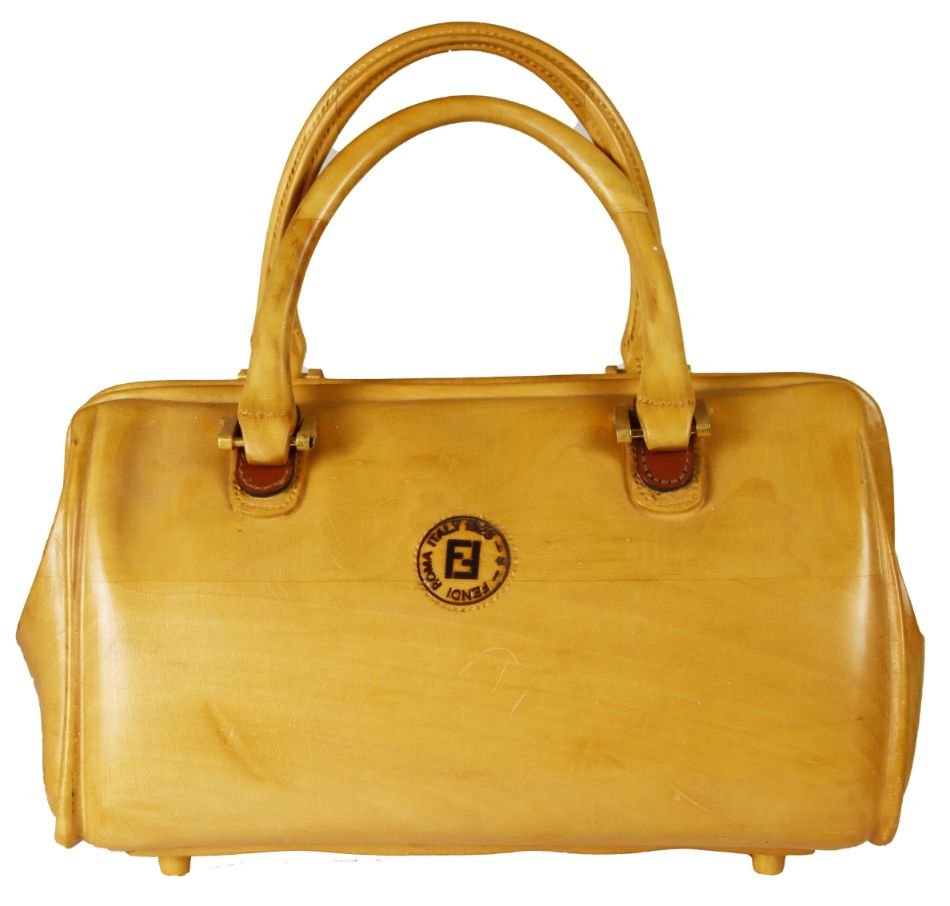 Rare Fendi Store Display Woman's Handbag Form: Rare Fendi Store Display From the 1980\'s in the form of a woman\'s handbag carved from wood. The handles articulate and is stamped with the Fendi logo on the front. The size is 12 x 5 3/4 x 11 1/2 in