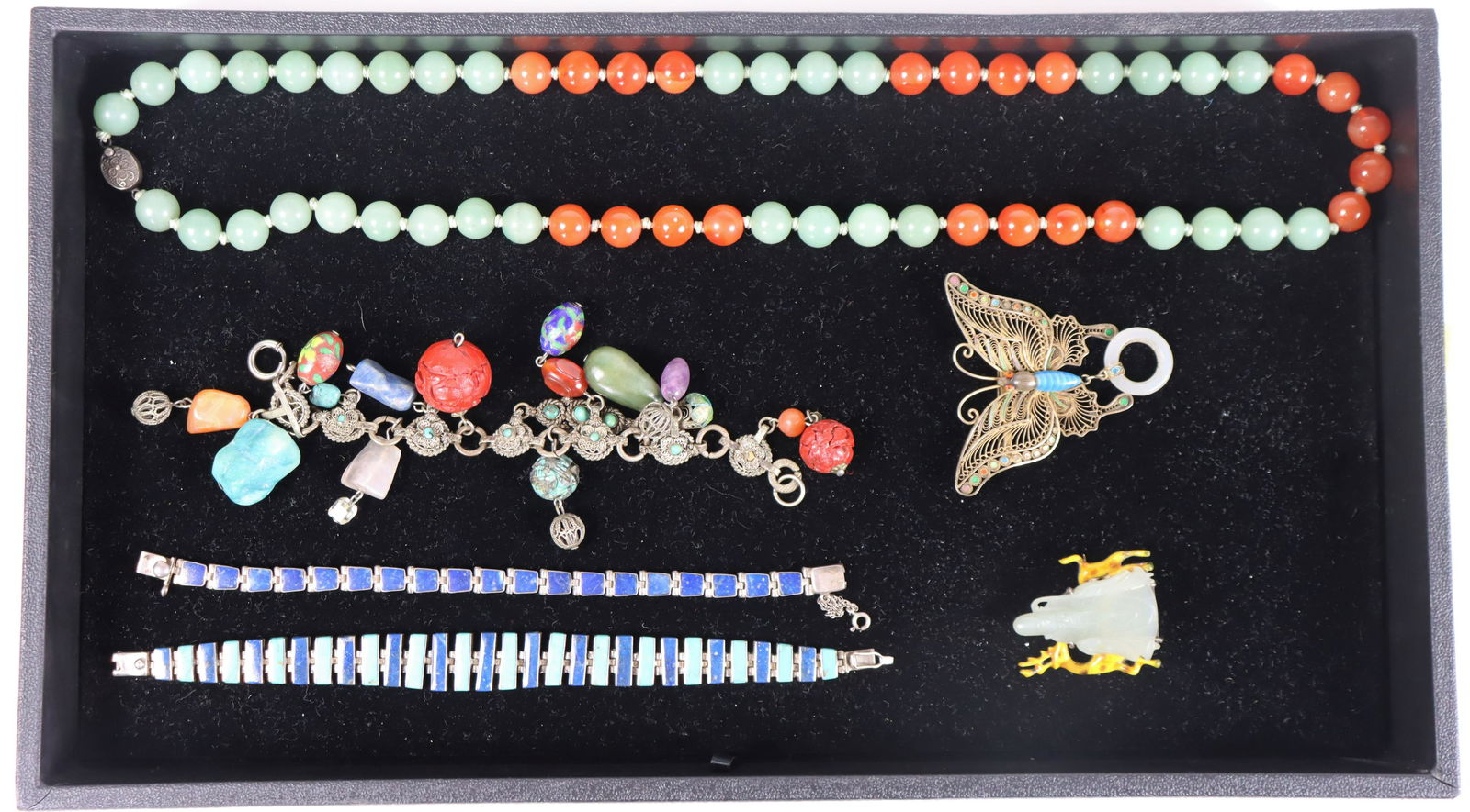 (6) Collection of Assorted Jewelry: Six pieces include: one beaded necklace, two enamel & silver bracelets, one charm bracelet, two brooches.Please note that all sales are final. No refunds will be given under any circumstances.