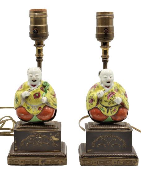 Pair of Chinese Lamps: Two glazed ceramic laughing figures set on bronze base. Size: 10 1/2 x 4 x 2 in.Please note that all sales are final. No refunds will be given under any circumstances.