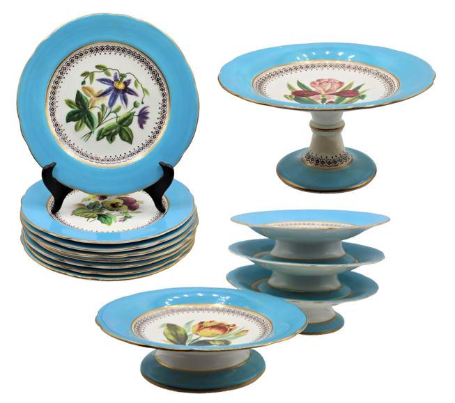 Set of 13 Porcelain Dish Dinnerware: Porcelain dinnerware set with floral design painted with blue rim. Year 1830 marked on dishes.Size of each (8) plate: 9 in. diameter Size of each (4) platter: 2 1/2 in.tall x 9 in. diameter Size of ta