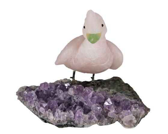 Stone Bird on Amethyst Base: This is a intriguing stone bird made of different materials that is stood upon an amethyst base. Size: 5 x 6 x 4 in. Please note that all sales are final. No refunds will be given under any circumstan