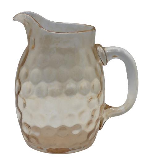 Hand-Blown Glass Pitcher: Lovely glass water pitcher with inverted thumbprint pattern. Size: 5 1/2 x 5 in. Please note that all sales are final. No refunds will be given under any circumstances.