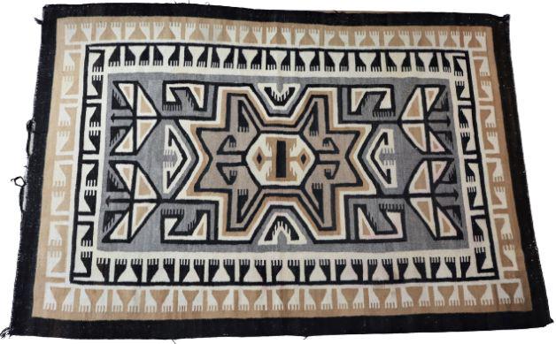 Geometric Woven Navajo ? Wool Rug: Hand-woven woolen rug with bold geometric design of black, brown, gray and cream. Likely from Central America, some wear on ends.Size: 72 x 48 in.Please note that all sales are final. No refunds will 