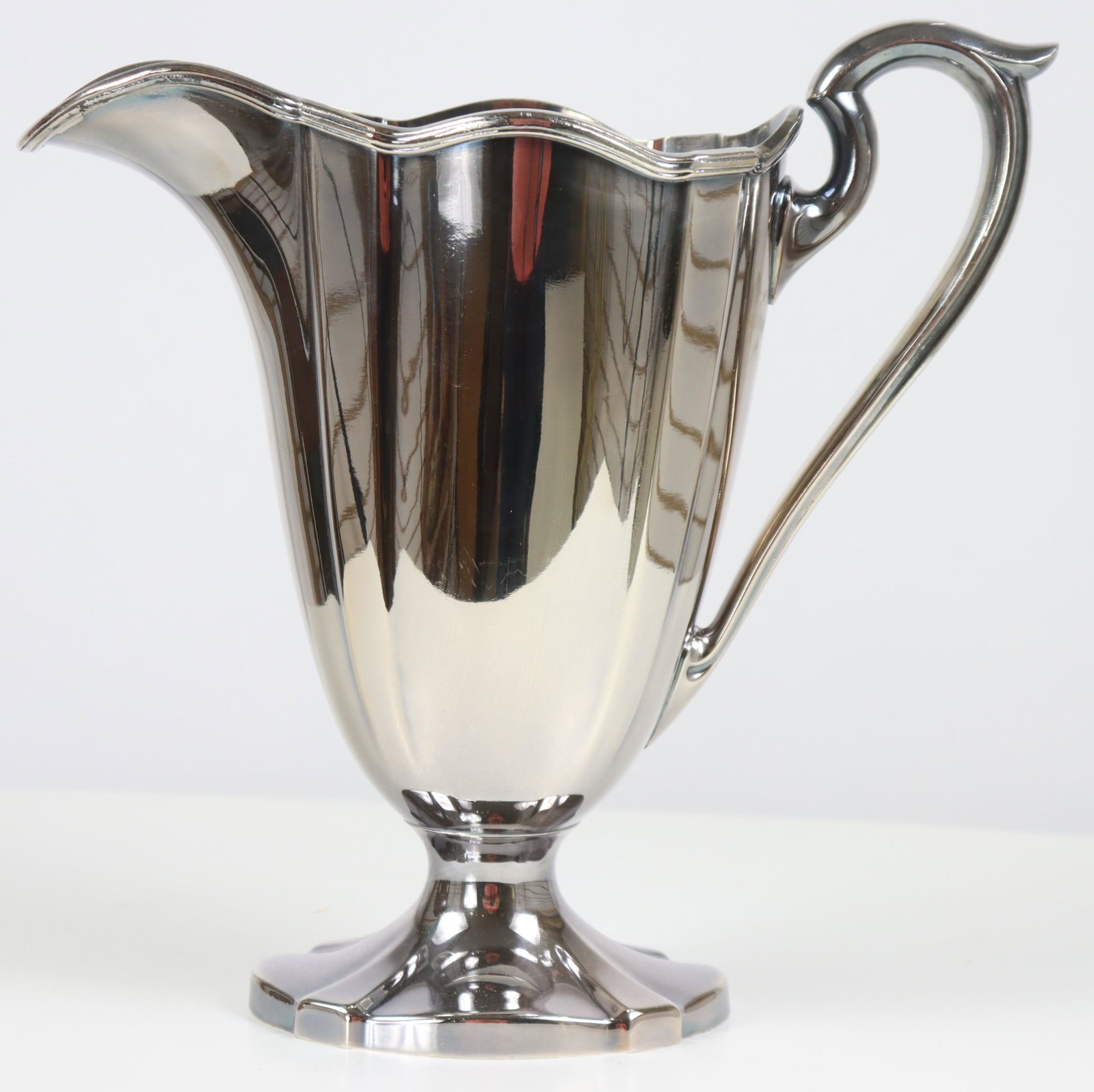 Silver Plated Helmet Form Water Pitcher: 11 x 5 1/2 x 10 1/2 Please note that all sales are final. No refunds will be given under any circumstances.